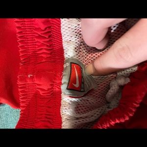 Red Nike wind pants